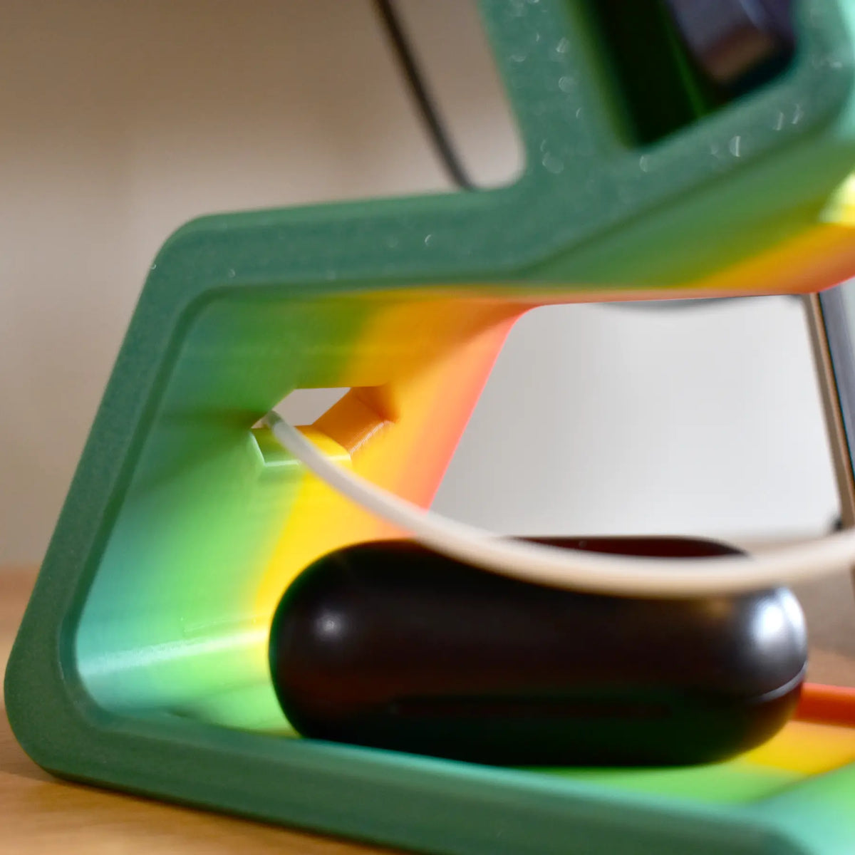 headset_and_phone_holder_charging_showcasing_organizing_cable_hole